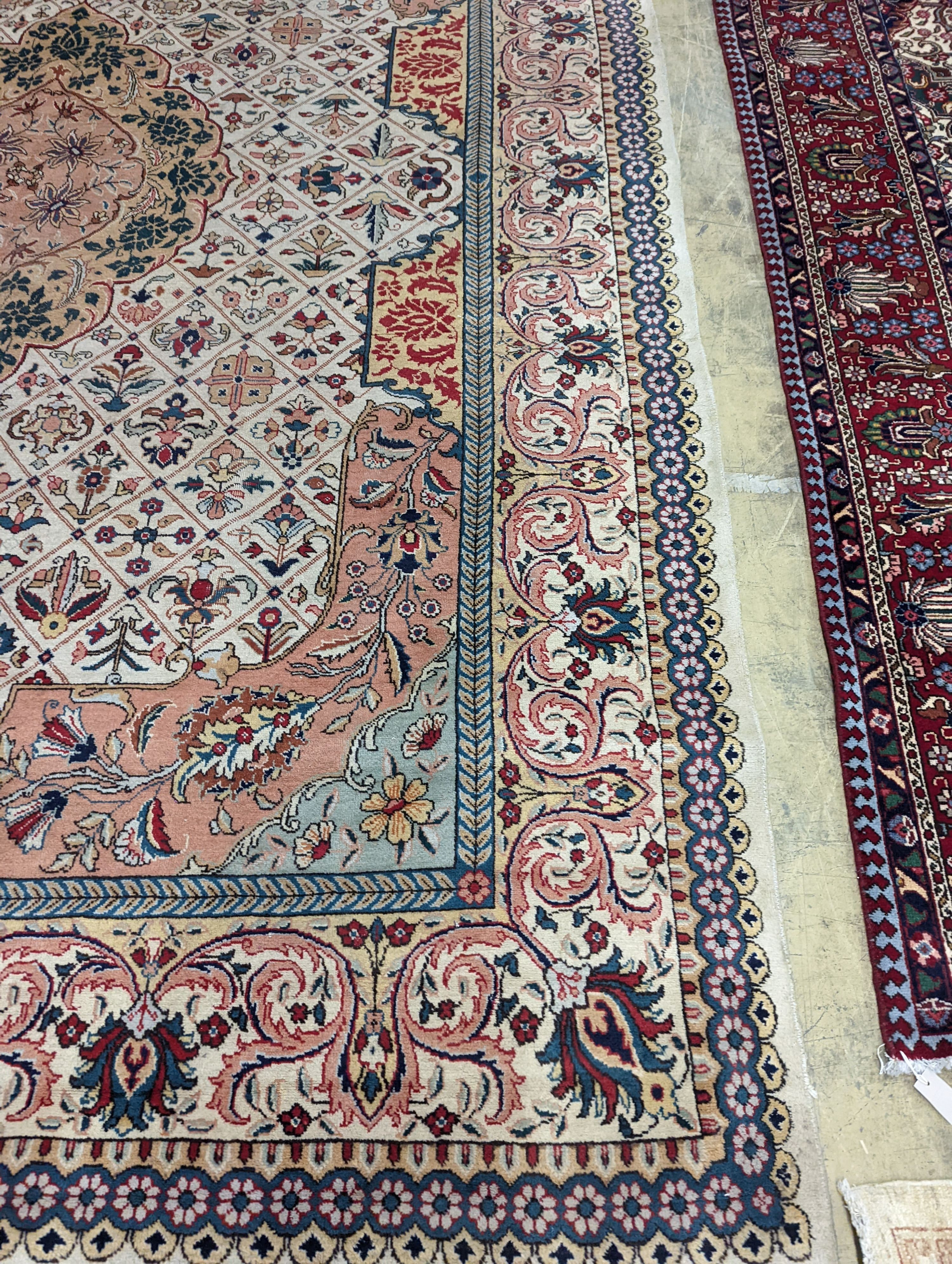 A Tabriz ivory ground carpet, 425 x 306cm